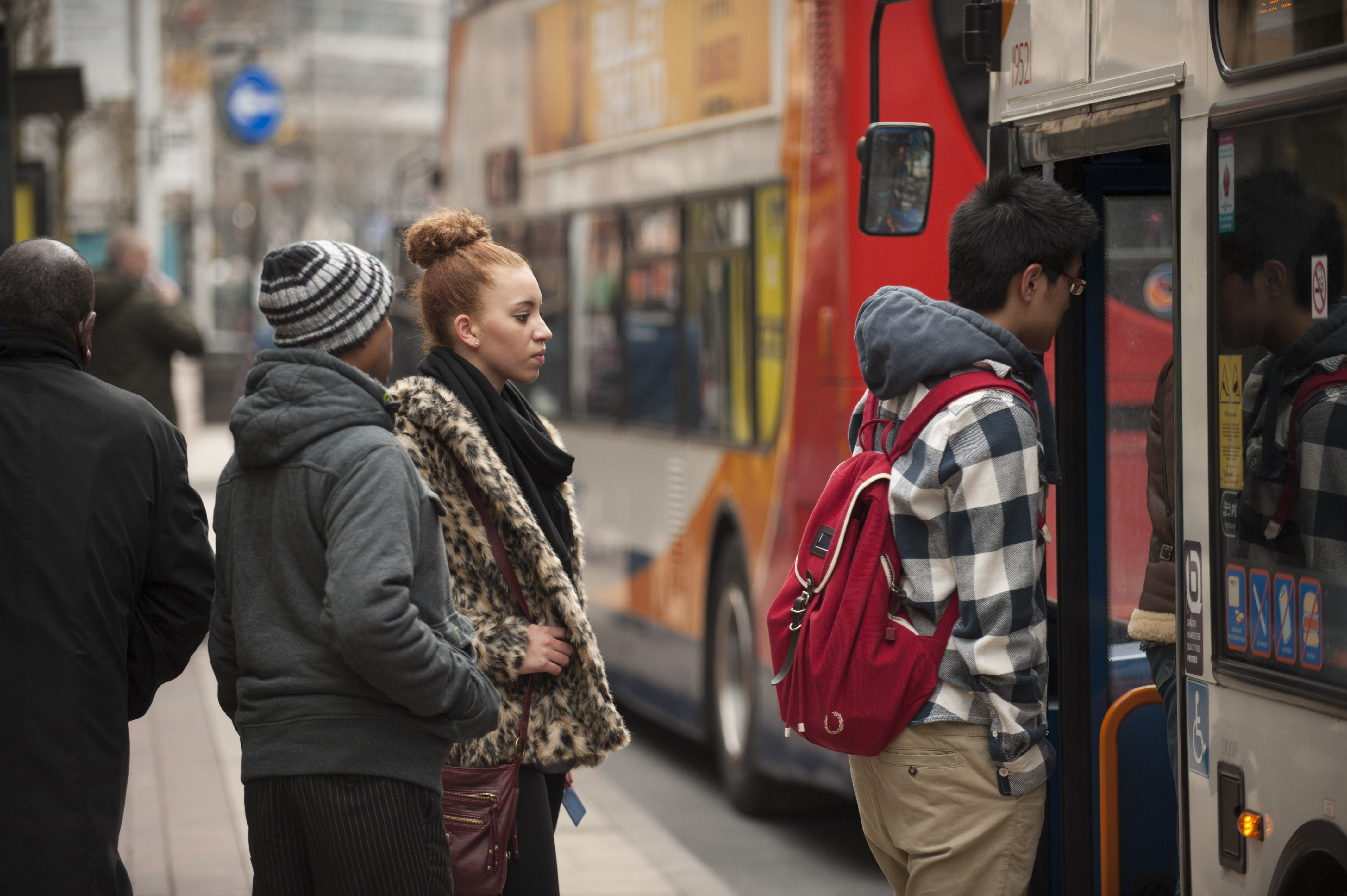 People getting on a bus