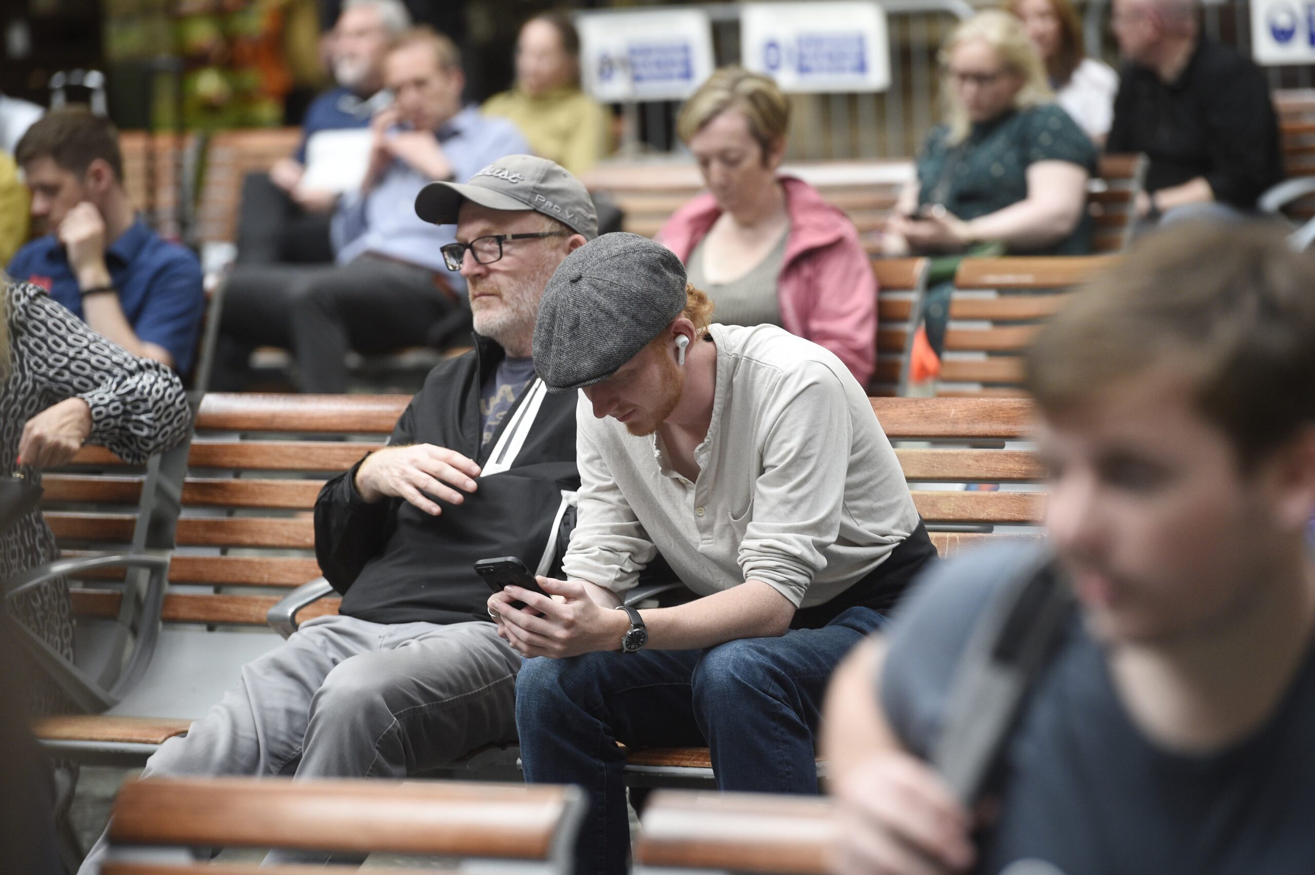 Passengers waiting at a train station.