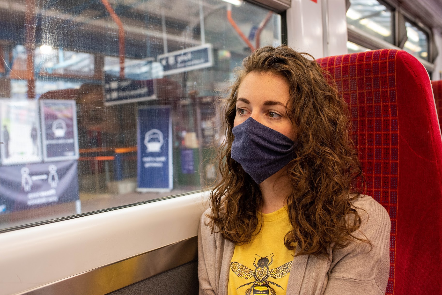 Woman in mask on SWR train